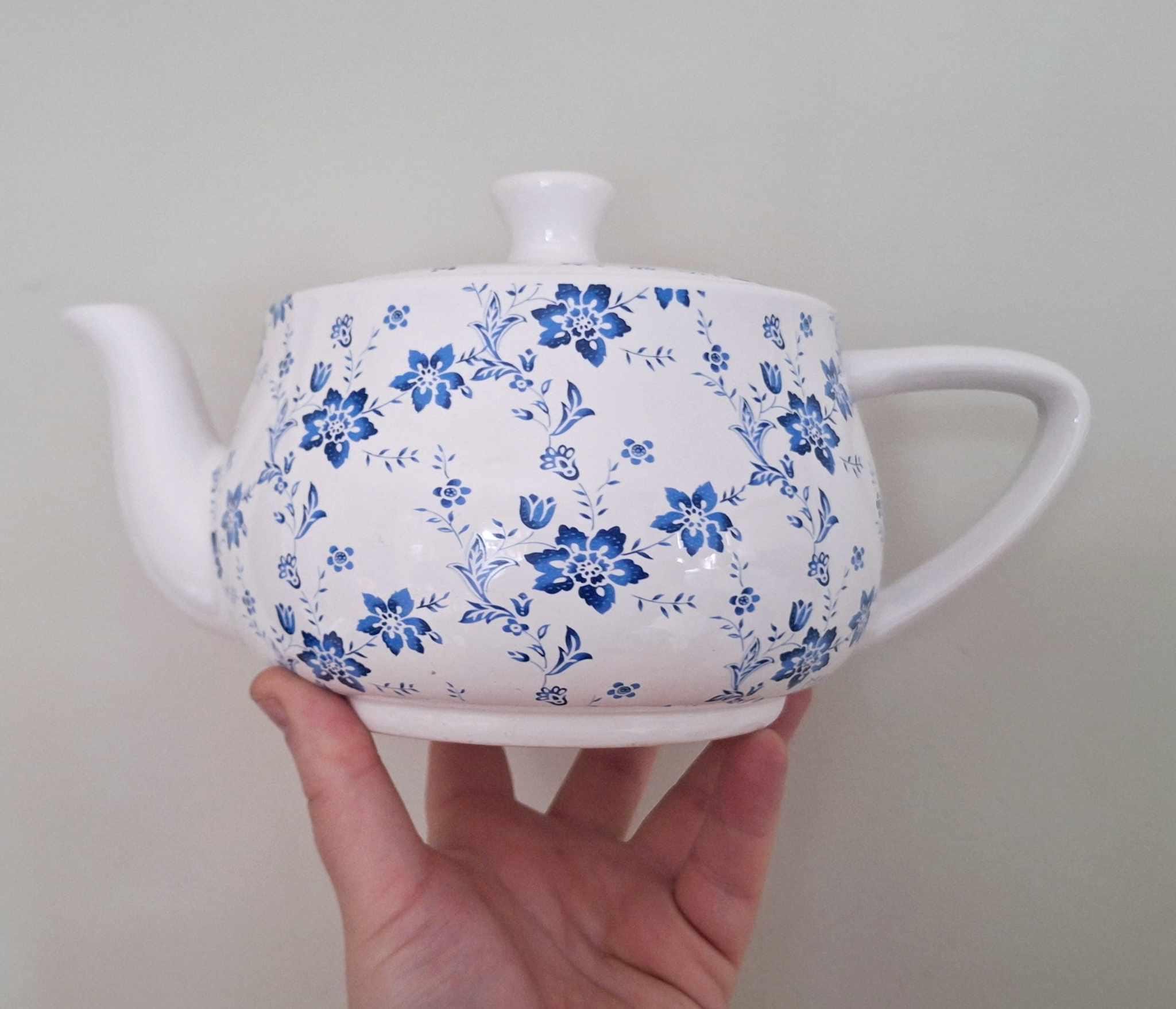 Vintage-style blue & white floral ceramic teapot  charming country cottage kitchen decor  classic and collectible piece