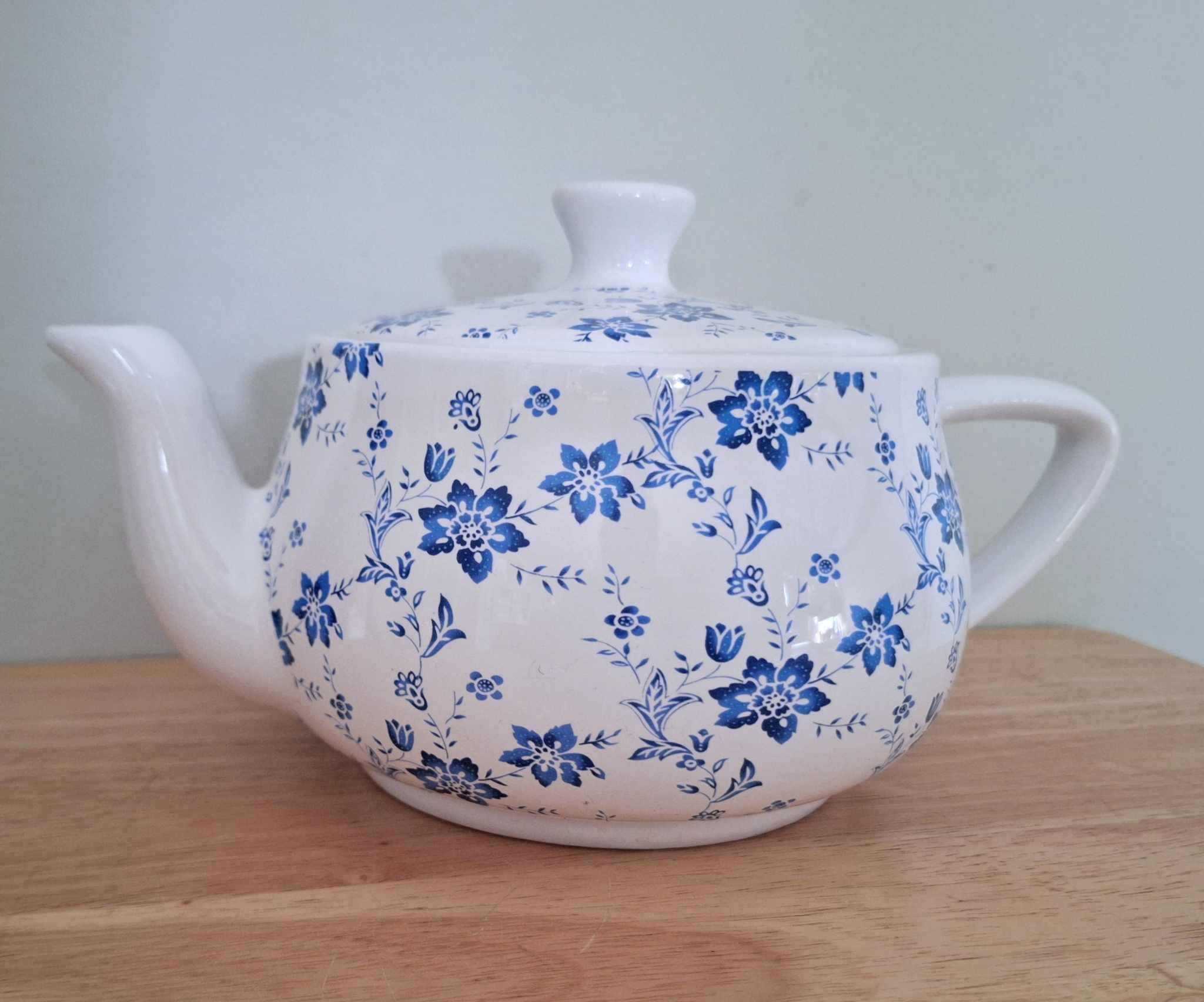 Vintage-style blue & white floral ceramic teapot  charming country cottage kitchen decor  classic and collectible piece