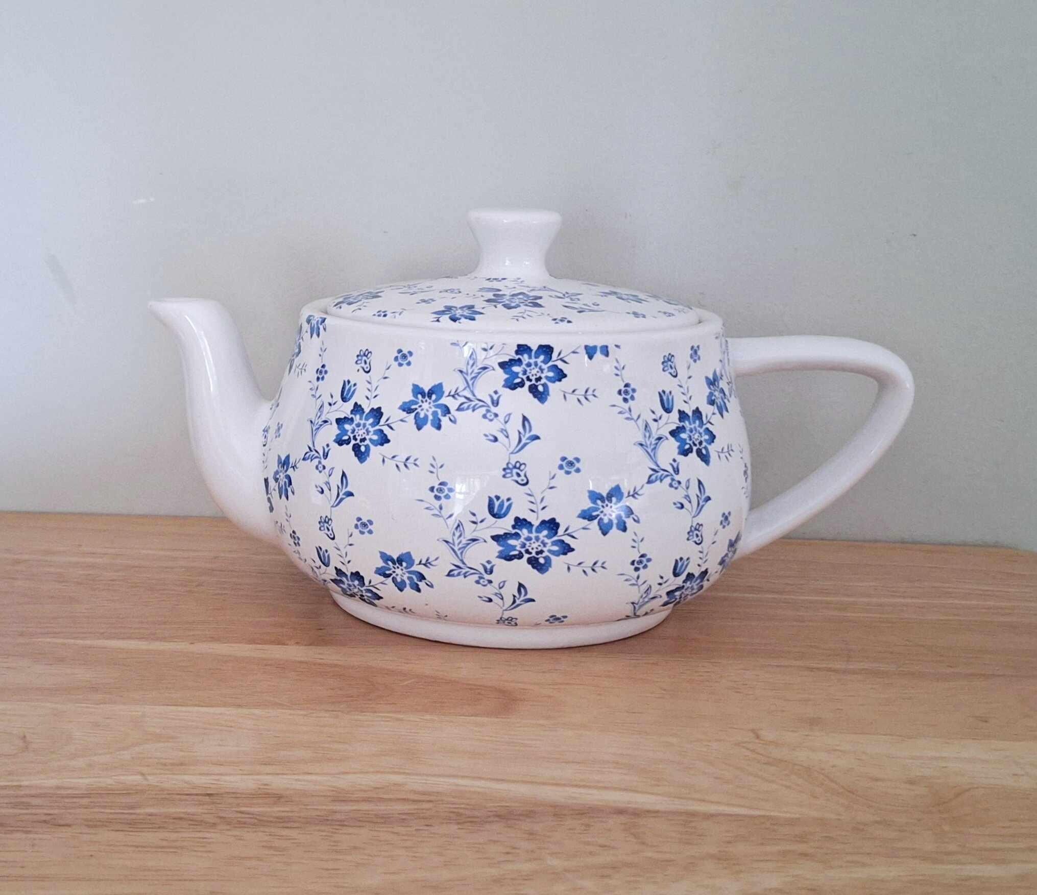 Vintage-style blue & white floral ceramic teapot  charming country cottage kitchen decor  classic and collectible piece